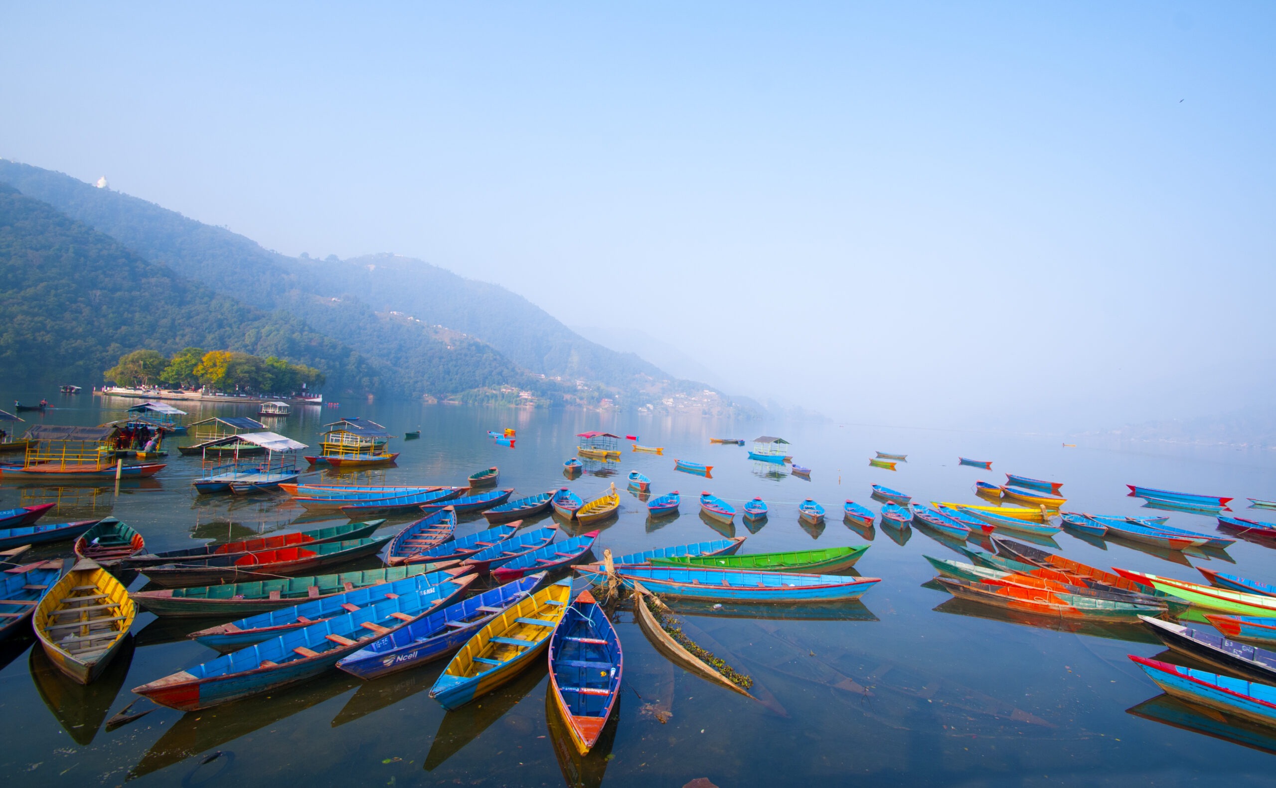 colorful wooden boat at fewa lake pokhara nepal 2024 09 17 02 53 26 utc scaled